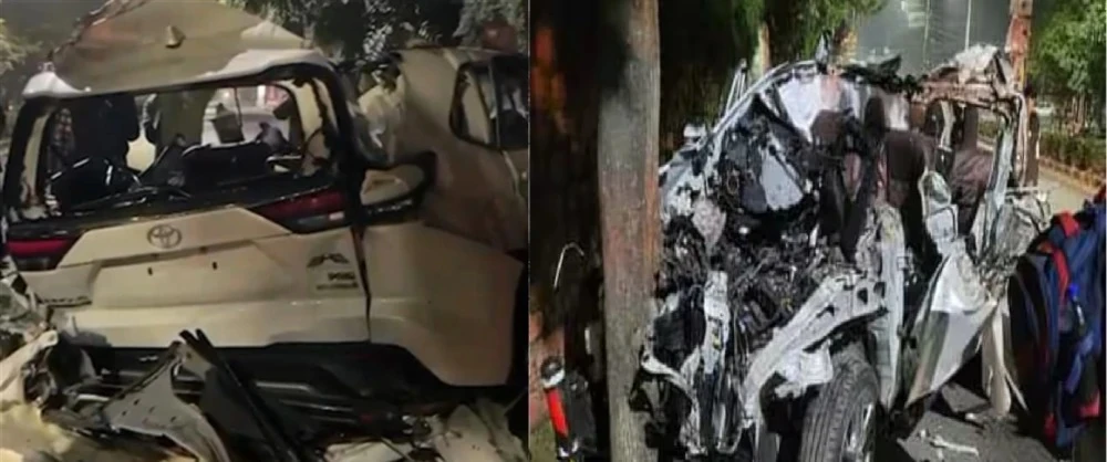 देर रात ओएनजीसी चौक पर हुए सड़क हादसे में क्षतिग्रस्त इनोवा कार के पास खड़ी पुलिस और आपातकालीन सेवाएं।