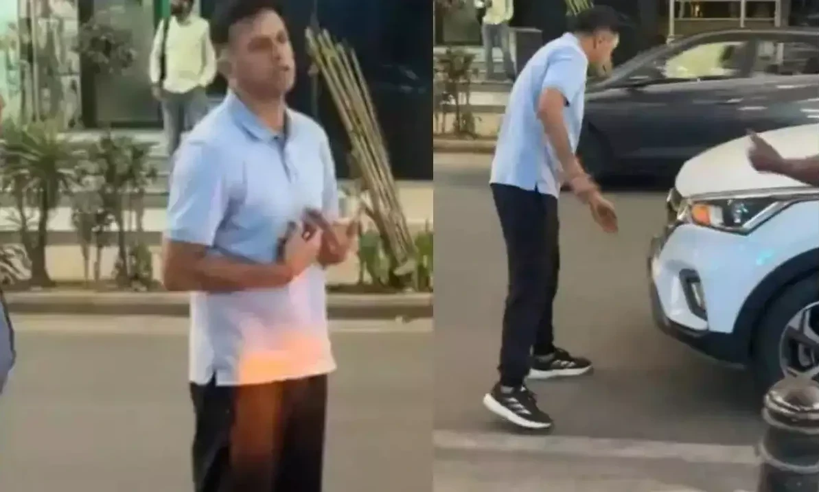 राहुल द्रविड़ बेंगलुरु में सड़क दुर्घटना के बाद ऑटो चालक से बहस करते हुए।