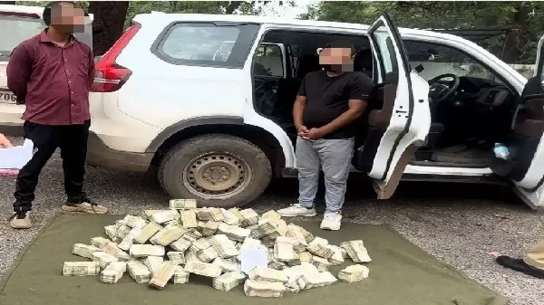 Police inspecting a Scorpio vehicle in Khairagarh, recovering Rs 4.04 crore cash suspected to be linked to hawala.