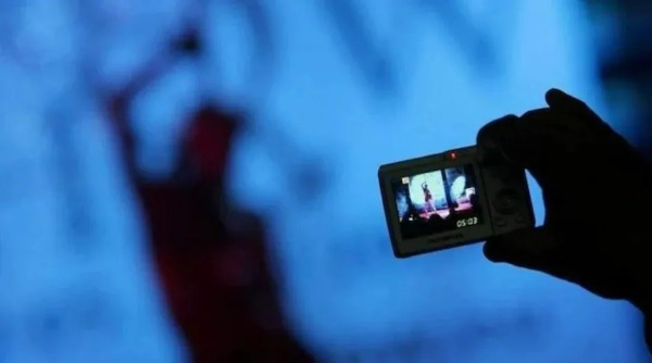 "LED advertisement board in Connaught Place, Delhi, displaying an explicit video, suspected to be the result of a hack."