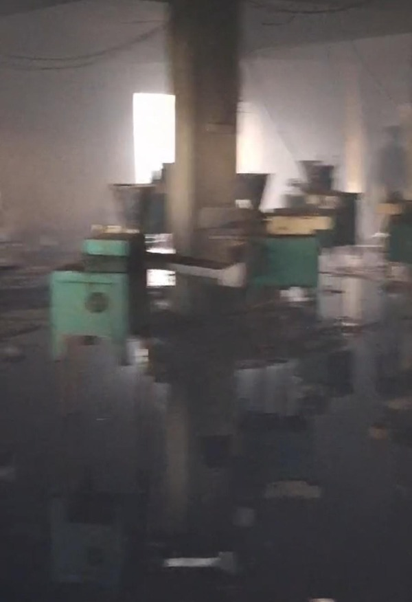 Firefighters at the scene of a blaze at an agarbatti factory in Lamba Kheda, Bhopal, on July 26-27, with damage assessment underway.